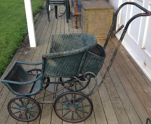 antique cane push chair with metal fittings wheels wooden spokes rubber rims Dolls and Teddy Bears